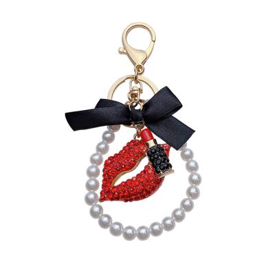 China Trend New Arrival Wholesale Popular Pom Bling Lips Bag Key Chain For Lady Car HandBag Accessories Decoration for sale