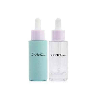 China Cosmetic Wholesale Empty Round Green Frosted Dropper Bottle Glass Cosmetic Bottle With Pump for sale