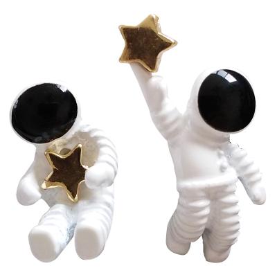 China TRENDY Astronaut Star Earrings Design Asymmetrical Starry Sky Astronaut Small Stud Earrings for sale