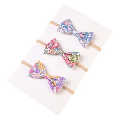 China Popular Korean Classical Small Fresh Bow Printing Children's Hair Accessories Pop Hair Elastic Circle for sale