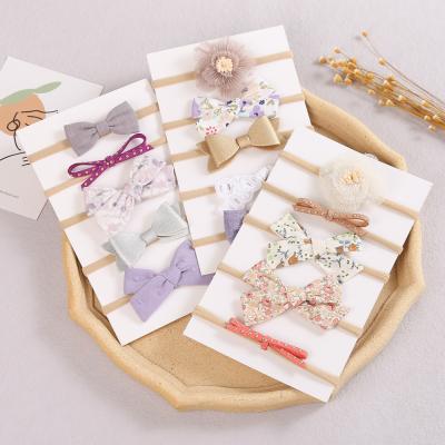 China Sporty Luxury Flower Elastic Headband Nylon Bows Baby Hair Accessories Headbands for sale