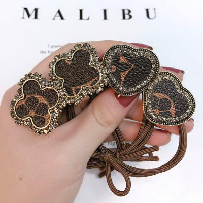 China Korean Designer Hair Bands Accessories Rhinestone Flower Women's Luxury Elastic Sports Headbands Wholesale for sale