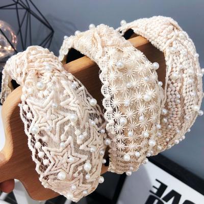 China Sporty Luxury Women Pearl Headband Skin Care Knotted Lace Pearl Bridal Headband For Women for sale