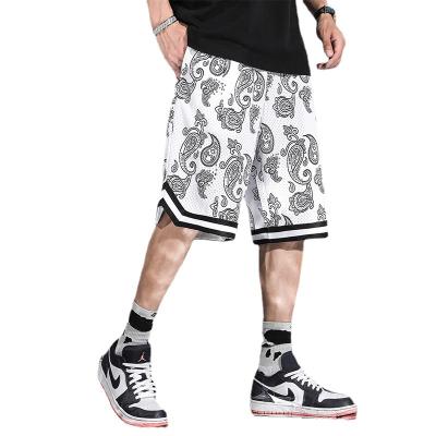 China Durable Mesh Cashew Flower Shorts Mens Summer Loose Capris Breathable Casual Sports Beach Shorts Mens Basketball Shorts for sale