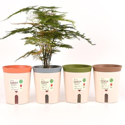 China Wholesale Eco-friendly Durable Plastic Self Watering Color Candy Planter Round 2 In 1 10.6*8*12.8cm Flower Pots With Visible Water Level for sale