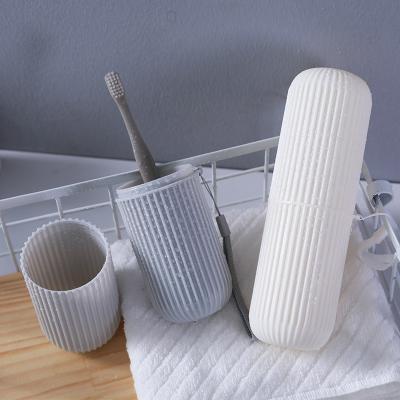 China Sustainable Wheat Straw Washing Set Water Bottle Portable Home Supplies Travel Wash Toiletries Toothbrush Storage Cup for sale