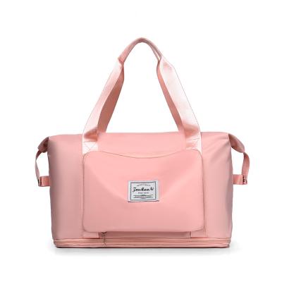 China Fashion Customized Logo Travel Bag Women Large Capacity Luggage Sports Tote Gym Pink Duffle Bag Waterproof For Women for sale