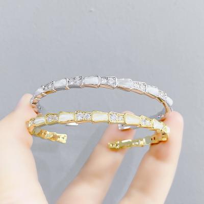 China TRENDY Shell snake bone fashion bracelet can open cat eye temperament cold wind female personality jewelry for sale