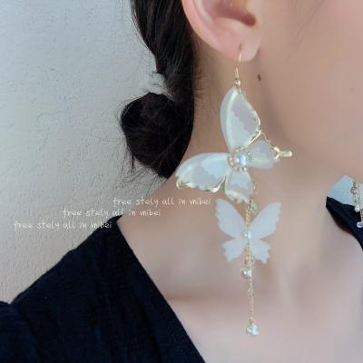 China FASHIONABLE Korean style butterfly long tassel earrings 2021 new exaggerated earrings women for sale