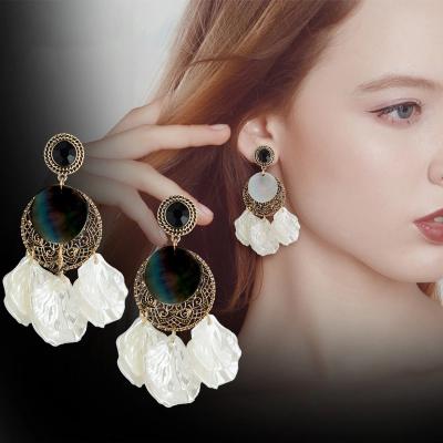 China 2021 Fashionable Bohemian earrings of new hollow gray helix-shaped diamond resin earrings shell retro for sale