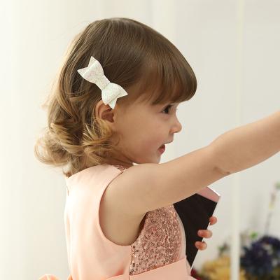 China The handmade bow tie about 6.5 cm of the glittery lychee pattern hairpin hair clip leather girl's bow tie for sale