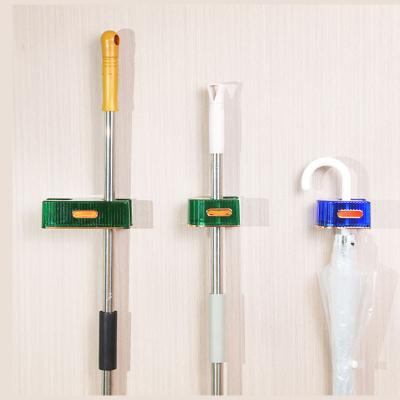 China Sustainable Bathroom Kitchen Storage Broom Handle Self Adhesive Super Anti-Slip Broom Hanger Broom Hook Holders for sale