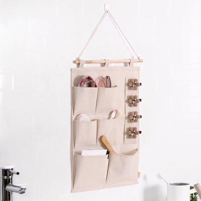 China Folding Storage Door Storage Pockets Hanging Cabinet Kitchen Storage Bag Cotton Fabric Canvas Hanging Organizer for sale