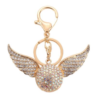 China Creative Gold Ribbon Crystal Snitch Diamond Gift Angel Decoration Metal Key Chain Wings Pendant Key Chain for sale