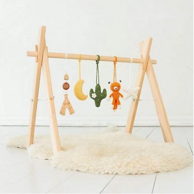 China Handmade Montessori Universal Infant Activity Center in Eastern Europe Baby Shower Foldable Natural Gift Wooden Baby Gym for sale