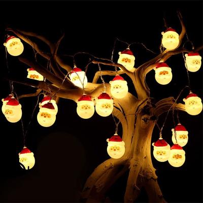 China Garden Christmas String Christmas Snowman Old Man Headlights Decorative Light Battery Lights Outdoor Party Fairy Lights for sale