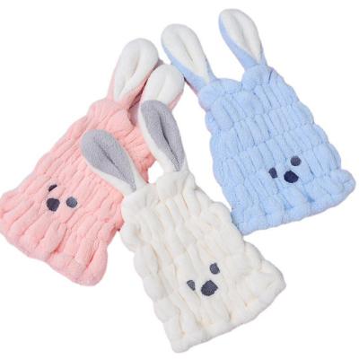 China Compressed Super Soft Coral Fleece Rabbit Ears Cute Baby Hair Turban Drying Hat for sale