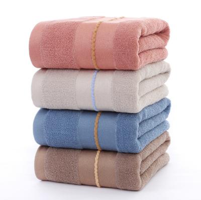 China Stylish Stripe Design Bath Towel Cotton Material And Water Absorbent Compressed 70cm X 140cm for sale