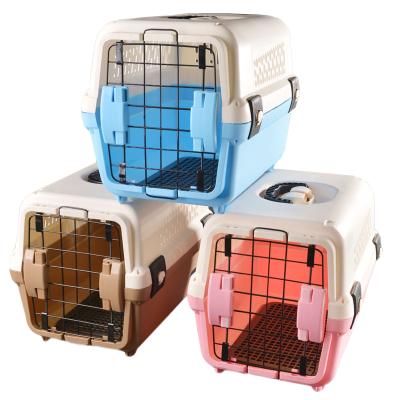 China Breathable Small Pet Travel Cage Dog Carrier Portable Crate Flight Plastic Pet Cage Carrier for sale