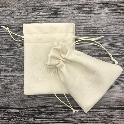 China Recyclable Cream Or Beige Drawstring Faux PU Leather Jewelry Packaging Pouches Customized for sale