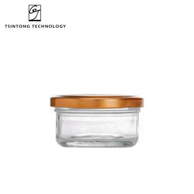 China Wholesale 70ml 2oz Modern Empty Clear Jar Round Bird's Nest Caviar Honey Jar Packaging Glass Bottles With Metal Lids for sale