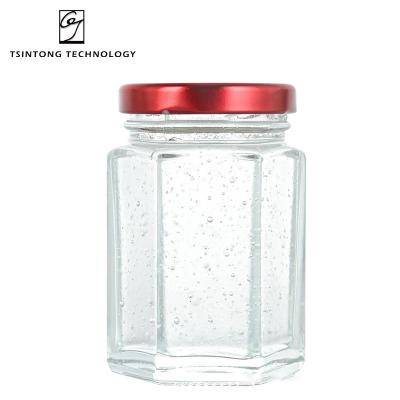 China Hot Sale Fashionable Hexagon Mini Glass Honey Jars Bird's Nest 40ml 80ml 120ml Jar With Metal Lids for sale