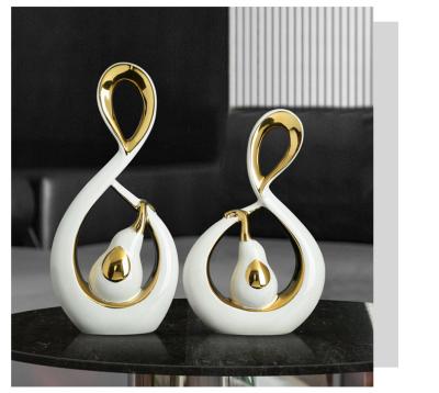 China Minimalist Custom made Elephant couples Nordic Luxury plated Gold White Porcelain Ornaments Home Decor Creative ceramic shape decoration for sale