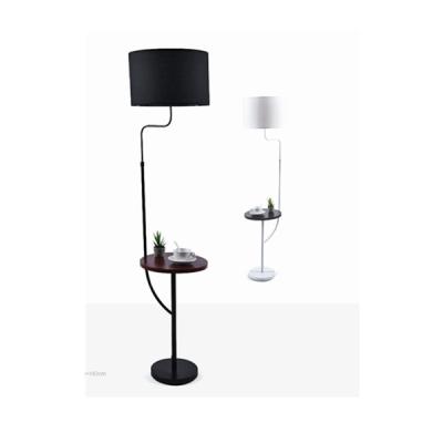 China Modern floor lamp with beam, bedroom metal fabric position lamp, decoration morden floor lamp with small table for sale