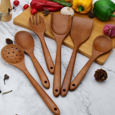 China Viable custom wholesale ruber printed logo kitchen accessories wood cooking wooden kitchen tool utensils set kitchen cookware for sale