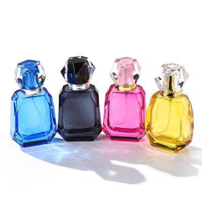 China Cosmetic 50ml empty perfume bottles glass 50ML clear spray colorful glass bottle for women perfume for sale