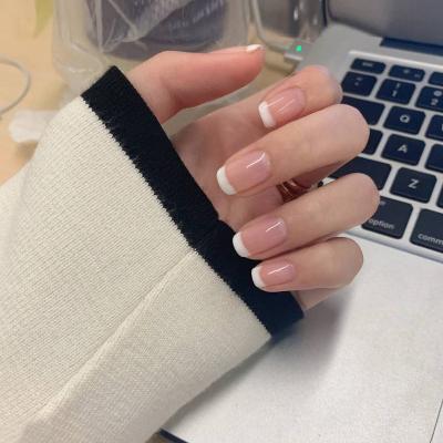 China Design French Style Nude Pink White Edge Press On Nails Simple Design Finished Nail Manicure Nail Tips for sale