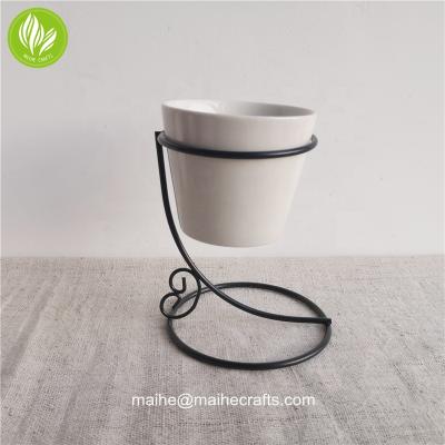 China Handmade metal oil burner with ceramic bowl for sale