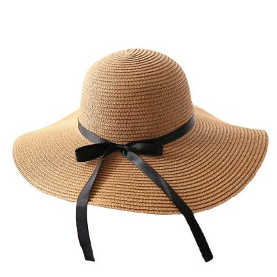 China Black Belt Bow Vacation Seaside Straw Hat Women Summer Foldable Comfortable Hot Selling Sun Visor Hats for sale