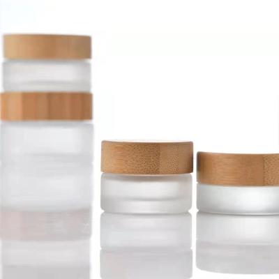 China Factory Wholesale 10g 20g 30g 50g 100g 150g Skin Care Cosmetic Packaging Jars Frosted Glass Bottle With Real Bamboo Cap for sale