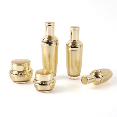 China Personal Luxury Gold Acrylic Empty Lotion Pump Bottles Packaging 30ml 50ml 80ml 120ml Emulsion Skin Care UV Cap for sale