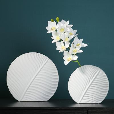 China Simple modern beige white cyan modern stylish decorative ceramic vases in the living room balcony study for sale