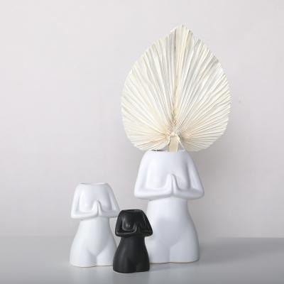 China Modern Unique Style Two Irregular White Black Color Decorative Ceramic Vase In Living Room Balcony Study for sale