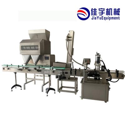 China Food Snack Packing And Automatic Small Scale Peanut Masala Tea Price Pouch Sealing Packaging Machine for sale