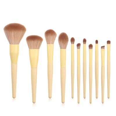 China Soft bristles 11pcs makeup brushes kabuki loose powder blush set brush yellow slant tube makeup set brush for sale