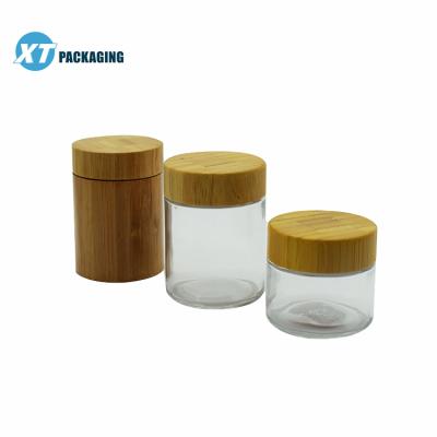 China Cosmetic Accept Glass Bottle Amber Black White Gold Customization Round Matte Glass Jars With Wooden Bamboo Lids for sale