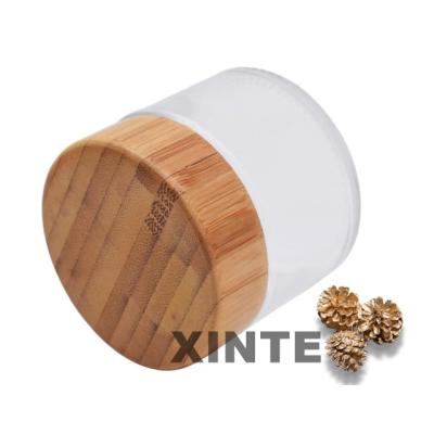 China Wholesale Price 2OZ 4OZ Cosmetic Glass Cosmetic Jar With BAMBOO/WOODEN Lid For Hot Stamping Acid Etching Matte Screen Printing Cosmetics for sale