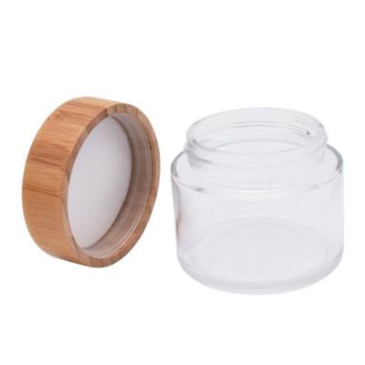 China Cosmetic Clear Round Airtight 4Oz Face Cream Frosted Lid Cookie Flower Glass Cosmetic Bamboo Wooden Storage Jar Set for sale