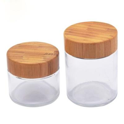 China Wholesale Safe High Quality Cosmetic Food Storage Round Bamboo Glass Cosmetic Frosted Jars With Bamboo Lid for sale