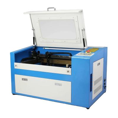 China Programmable 6090 Laser Cutting Machine Orange All 50w 60w 80w 100w Laser Engraving Machine for sale