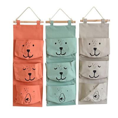 China Sustainable Hanging Type 3Pockets Storage Organizer Bag Folding Wardrobe Hang Closet Bag Wall Organizer Home Storage Bag for sale