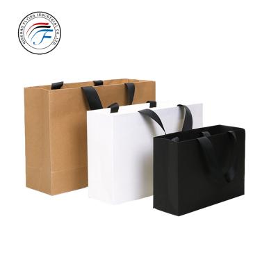 China OEM Promotion Low Cost Matt Recyclable PE Coated Laminated Craft Paper Shopping Bag for sale