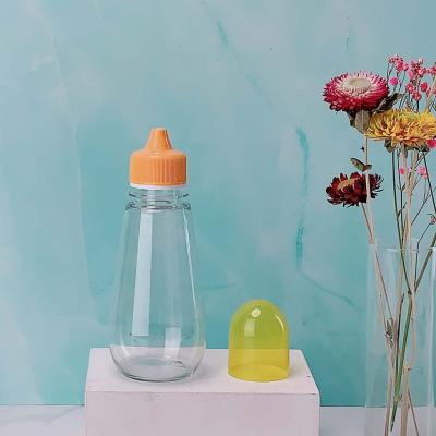 China 2021 New Arrival Food Packaging Drop Shape 270ml 380g Honey Squeeze Bottle With PP Plastic Spout Lid for sale