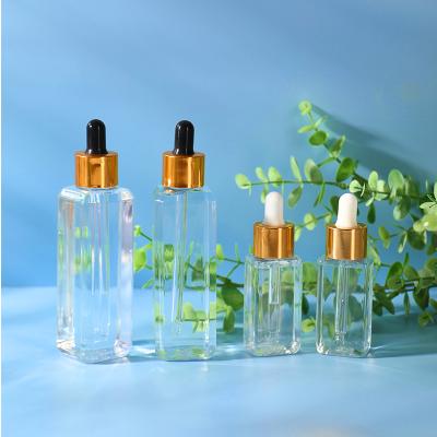 China 30ml 100ml Essential Oil Serum Shoulder Square Cosmetic Packaging Custom Flat Dropper Bottles for sale