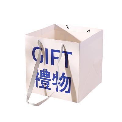 China Toowin Custom Brown Ribbon Handle Paper Bag for Clothing Made from Recycled Materials for sale