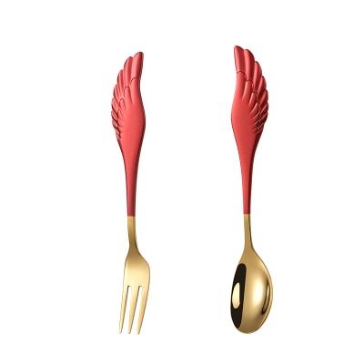 China Stainless Steel Viable Creative Cute Wings Spray Painted Handle Fork Spoon Set Ice Cream Dessert Teaspoon Fruit Fork for sale